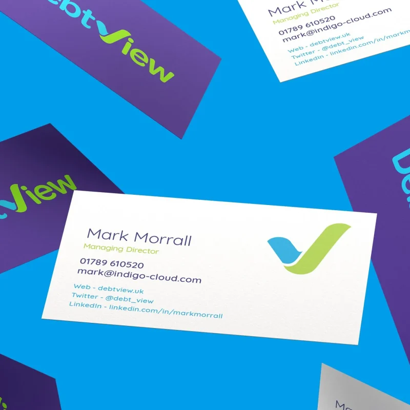 DebtView business cards with the new V and tick logo, scattered on a bright blue background